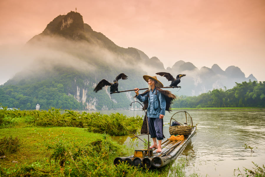 Persona disfrutando de Yangshuo cormoran